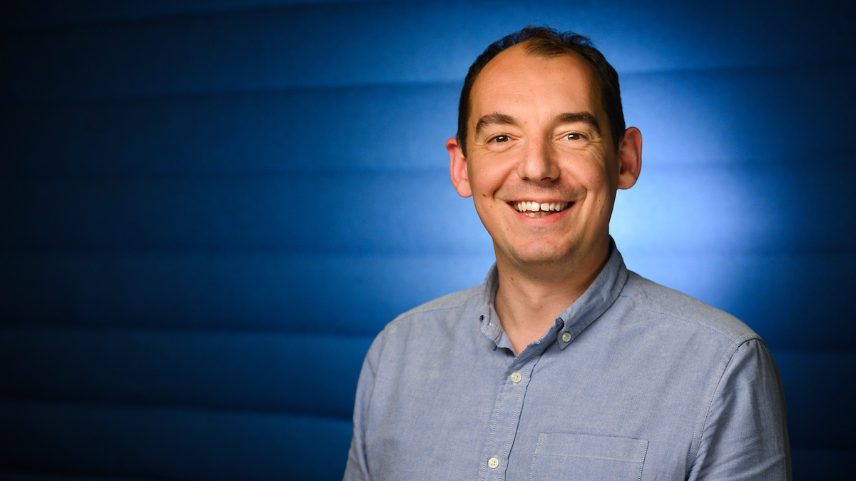 Will Tracz Chief Technology Officer on Blue Background